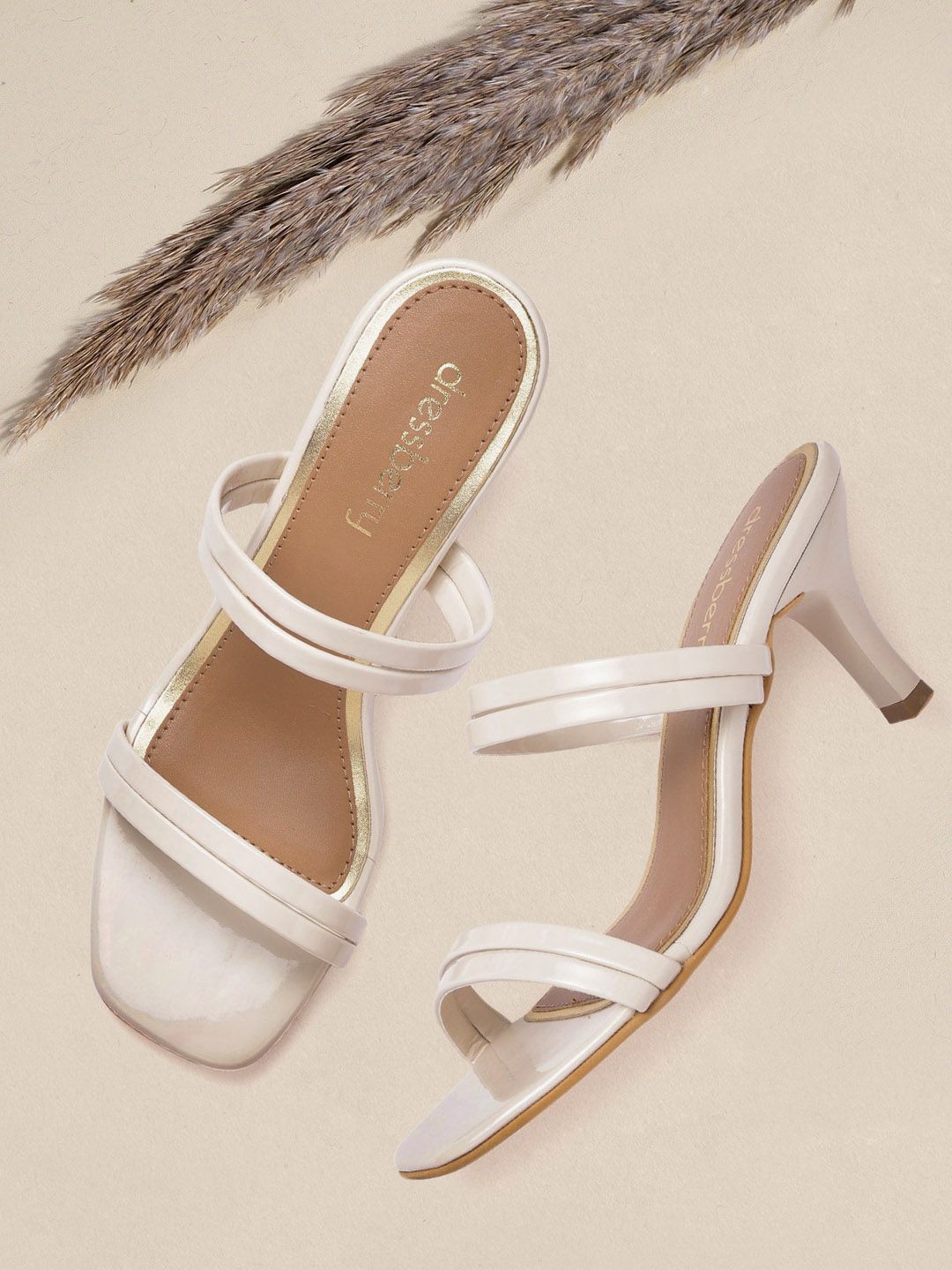 DressBerry Women Off White Solid Slim Heels Price in India