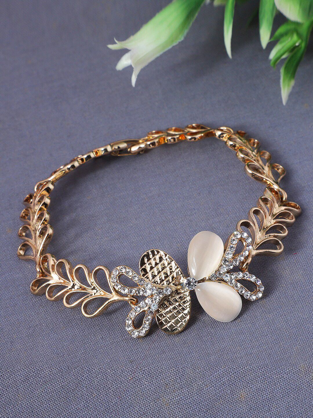ANIKAS CREATION Rose Gold Plated & White Stones Studded Brass Handcrafted Link Bracelet Price in India