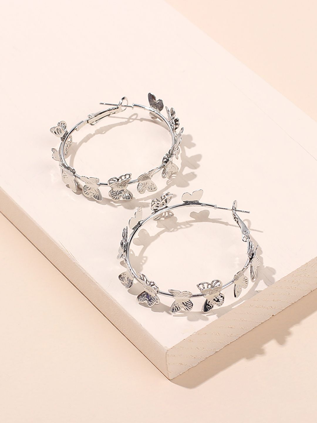 URBANIC Silver-Toned Circular Hoop Earrings Price in India