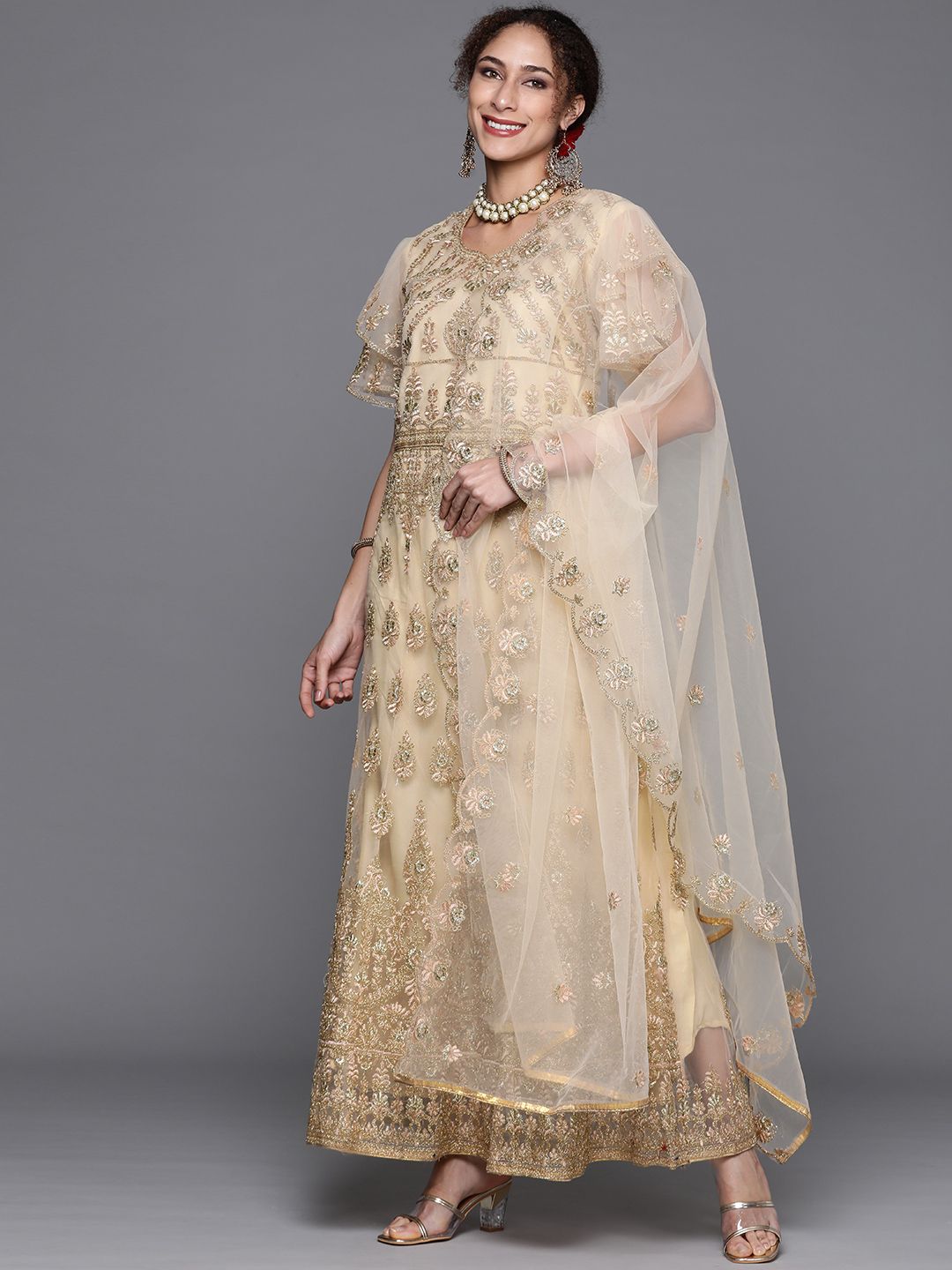 Chhabra 555 Cream & Gold Embroidered Semi-Stitched Zari Gown & Dupatta Price in India