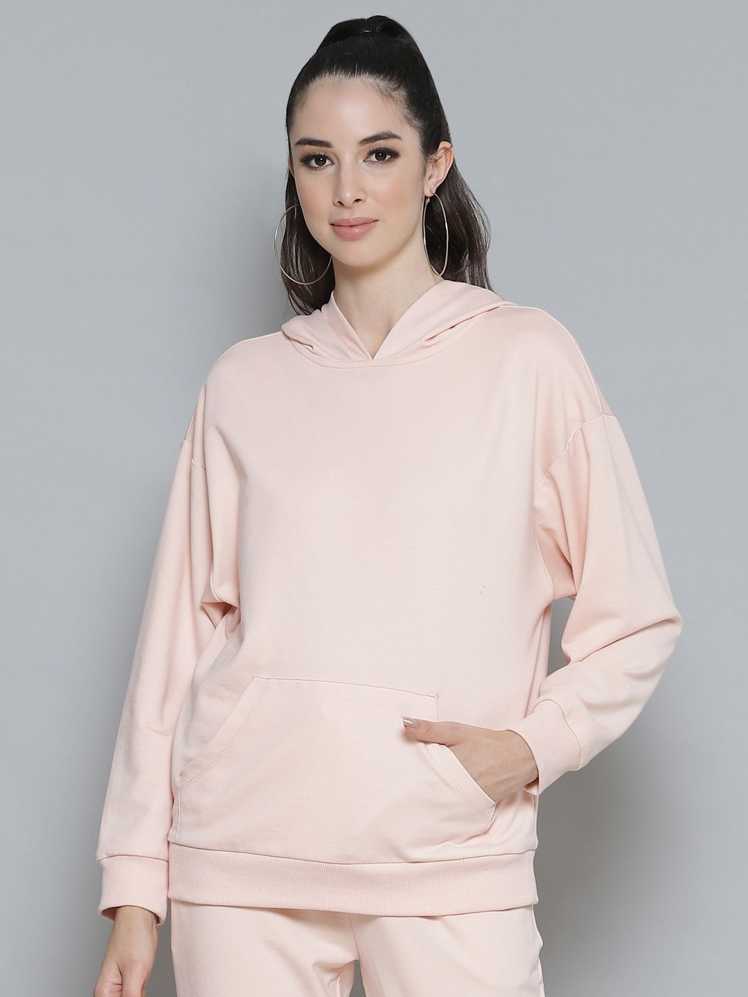 Femella Women Pink Drop Shoulder Hooded Sweatshirt Price in India