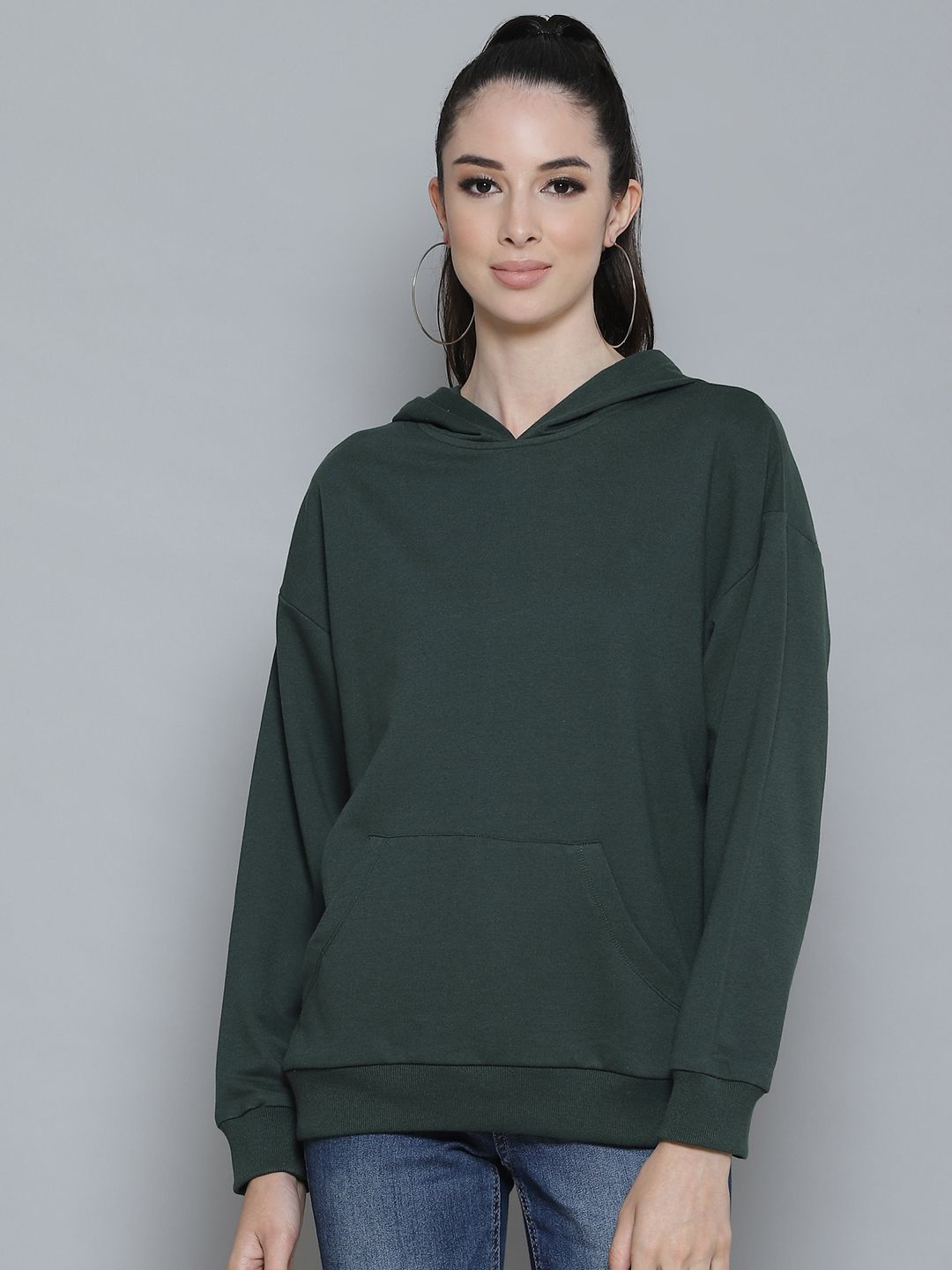 Femella Women Green Solid Hooded Sweatshirt Price in India