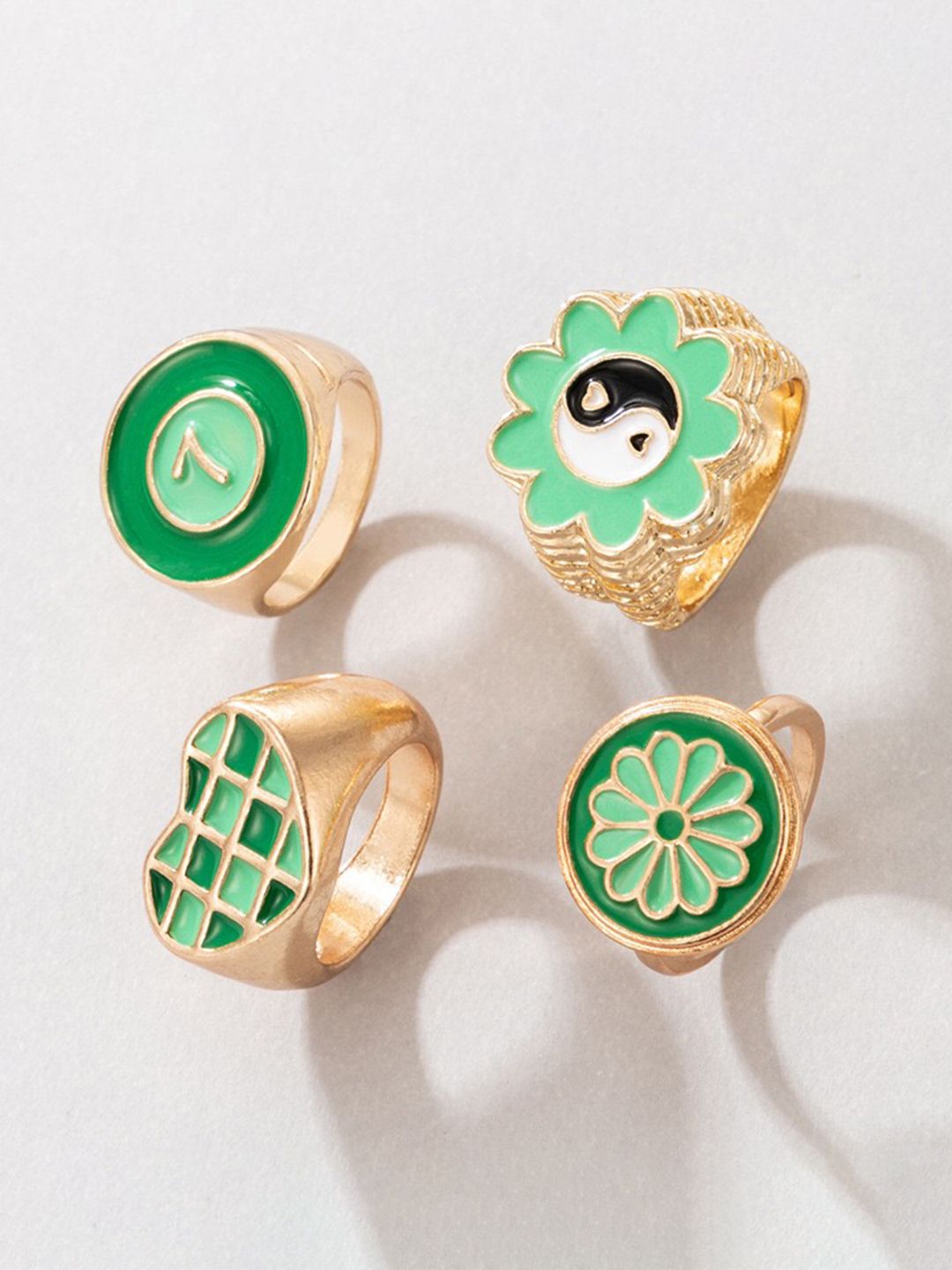 YouBella Set Of 4 Gold-Plated Green & White Enamelled Finger Rings Price in India