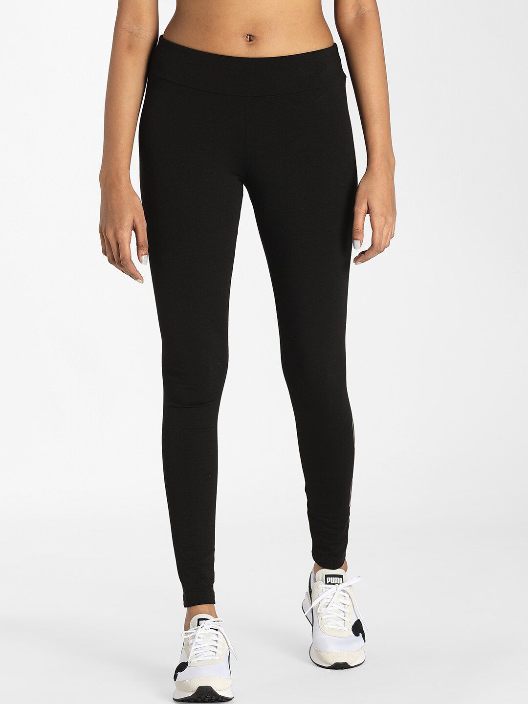 Puma Women Black & Gold Brand Logo Print Holiday Tight Fit Tights Price in India