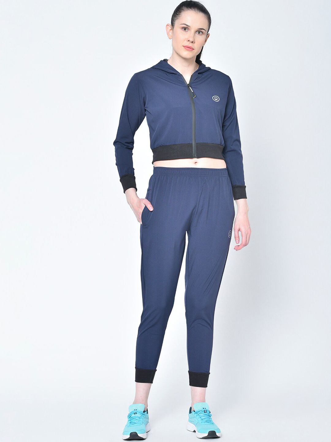 Chkokko Women Navy Blue Solid Sports Tracksuit Price in India