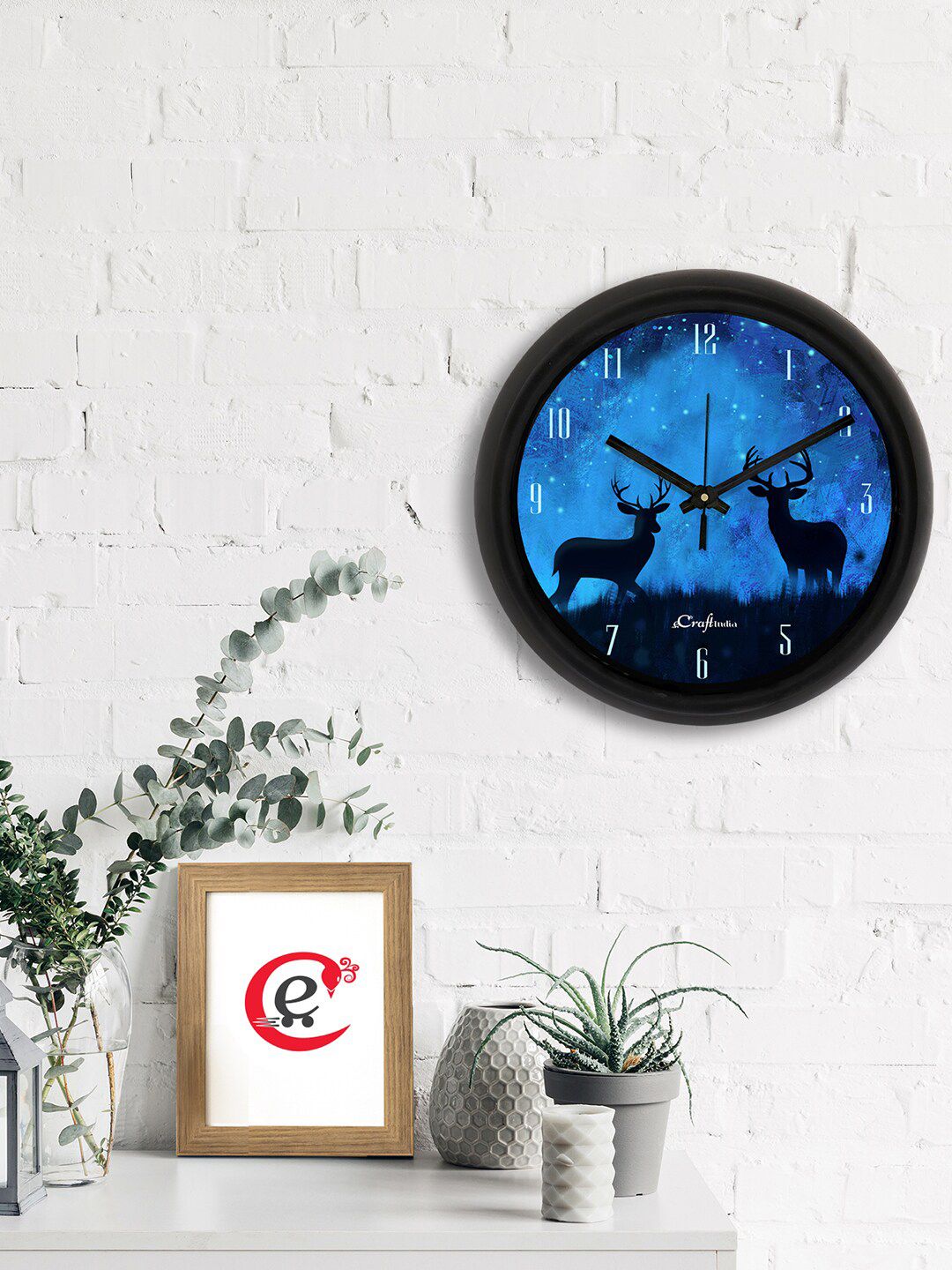 eCraftIndia Blue & Black Deer Printed Contemporary Analogue Wall Clock Price in India