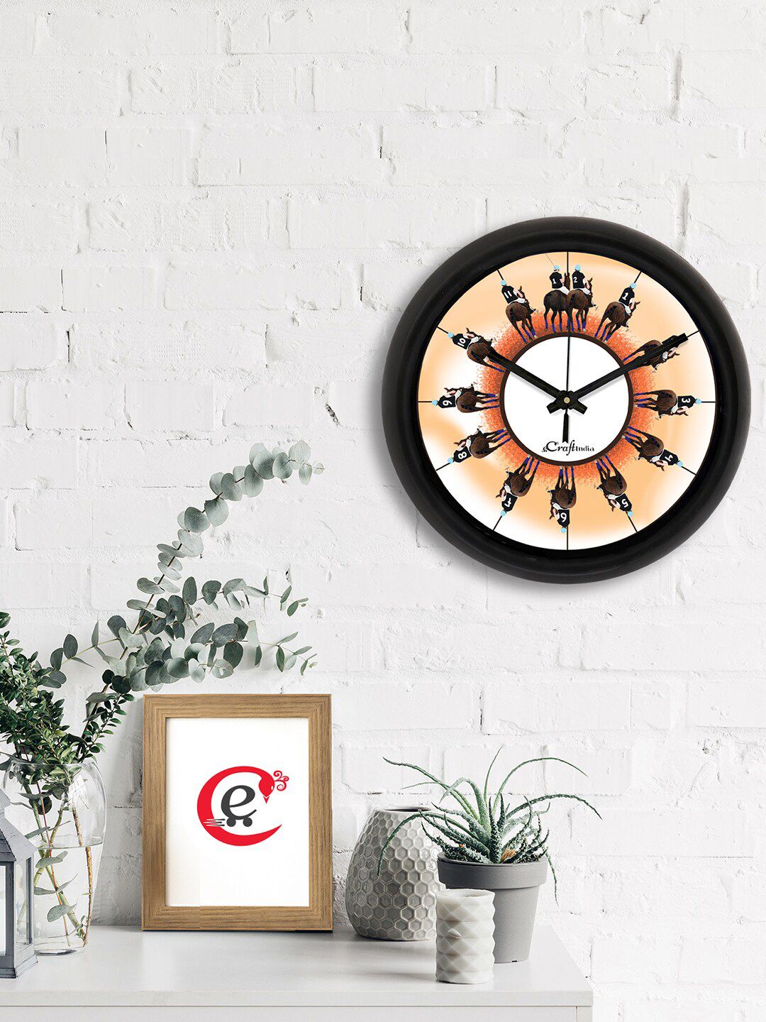 eCraftIndia Brown & Orange Horse Riding Printed Contemporary Analogue Wall Clock Price in India