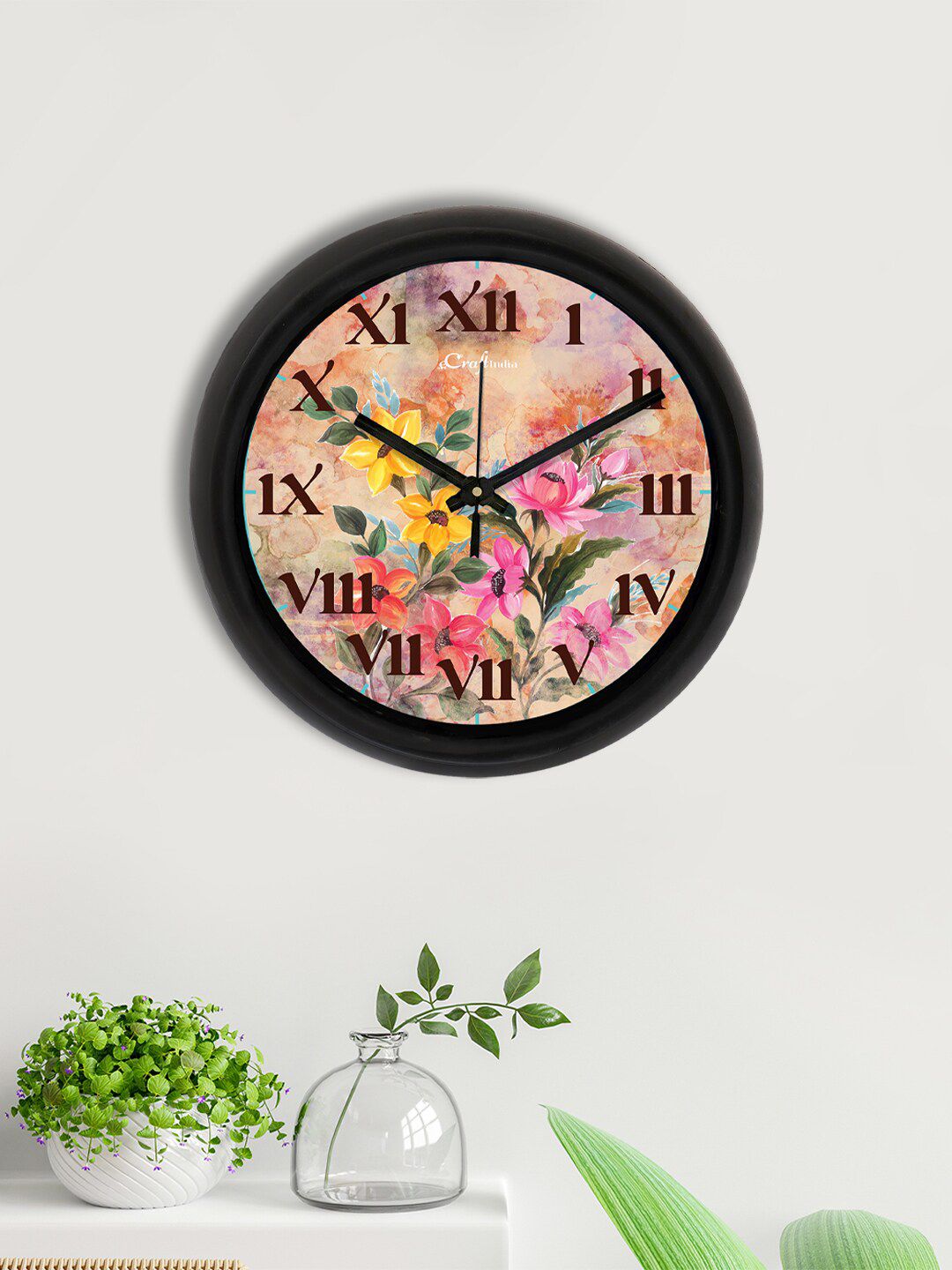 eCraftIndia Pink & Black Floral Printed Contemporary Analogue Wall Clock Price in India