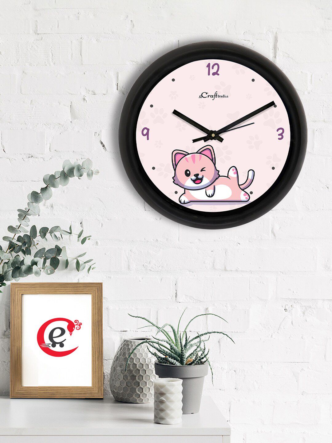 eCraftIndia Pink & Black Winky Cat Printed Contemporary Analogue Wall Clock Price in India