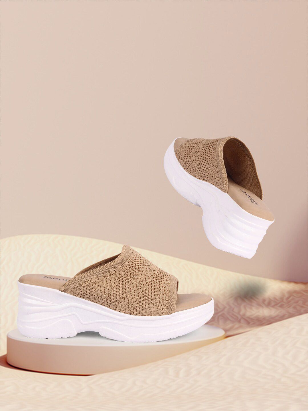 ZAPATOZ Women Beige Textured PU Wedges with Laser Cuts Price in India