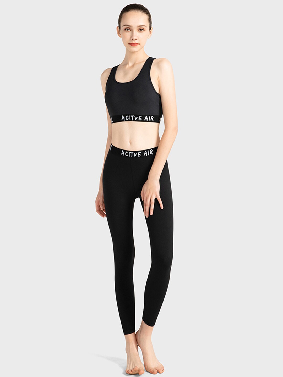URBANIC Women Black Solid Slim Fit Padded Gym Track Suit Price in India
