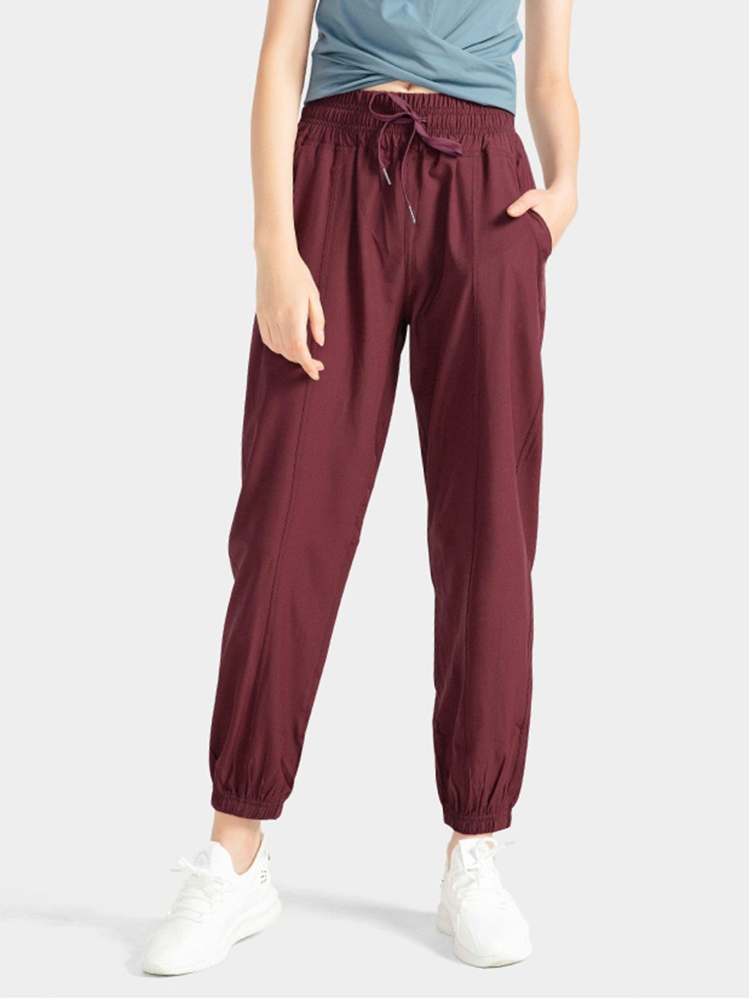 URBANIC Women Burgundy Solid Relaxed Fit Cropped Joggers Price in India