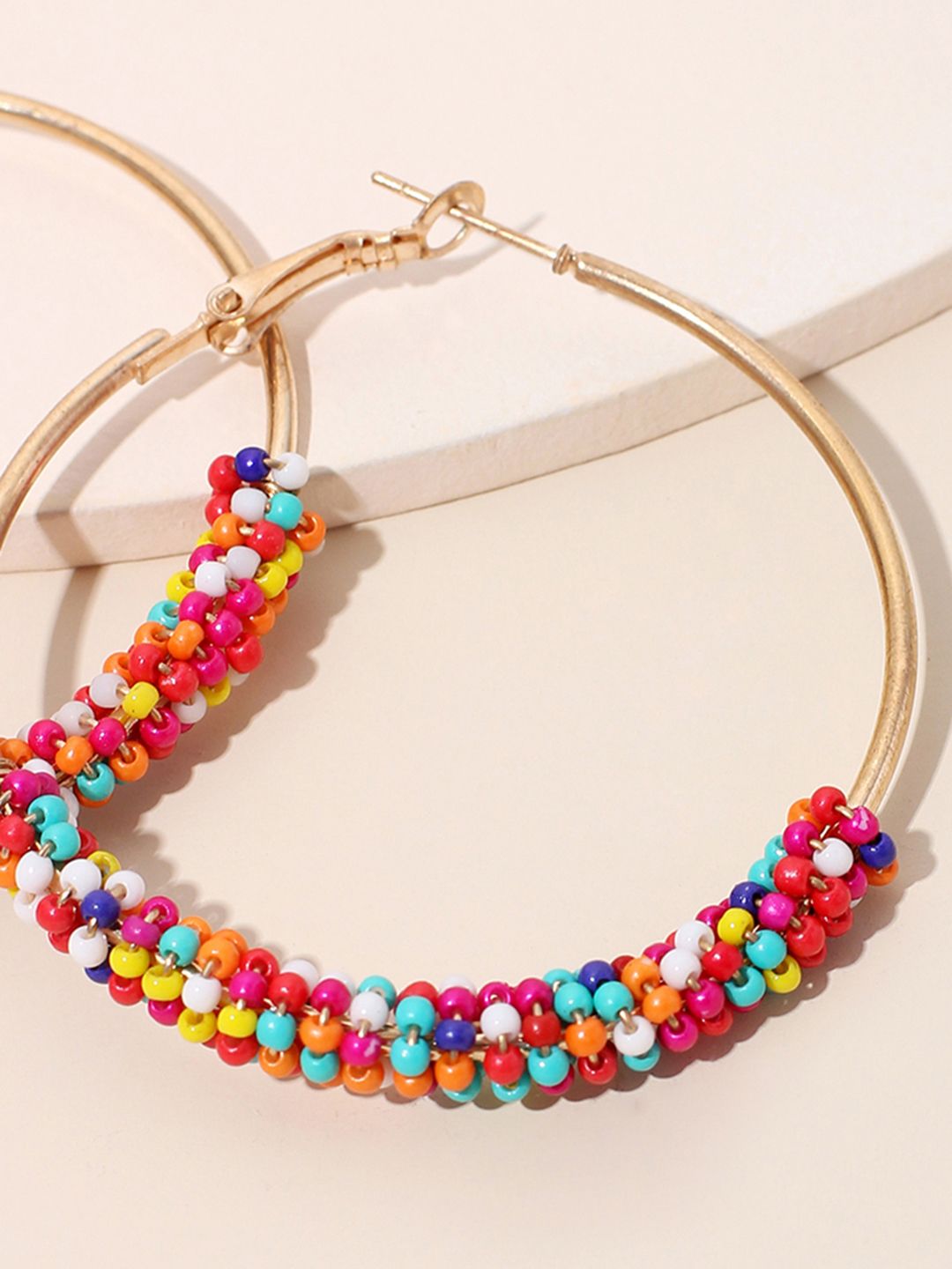 URBANIC Multicoloured Beaded Circular Hoop Earrings Price in India