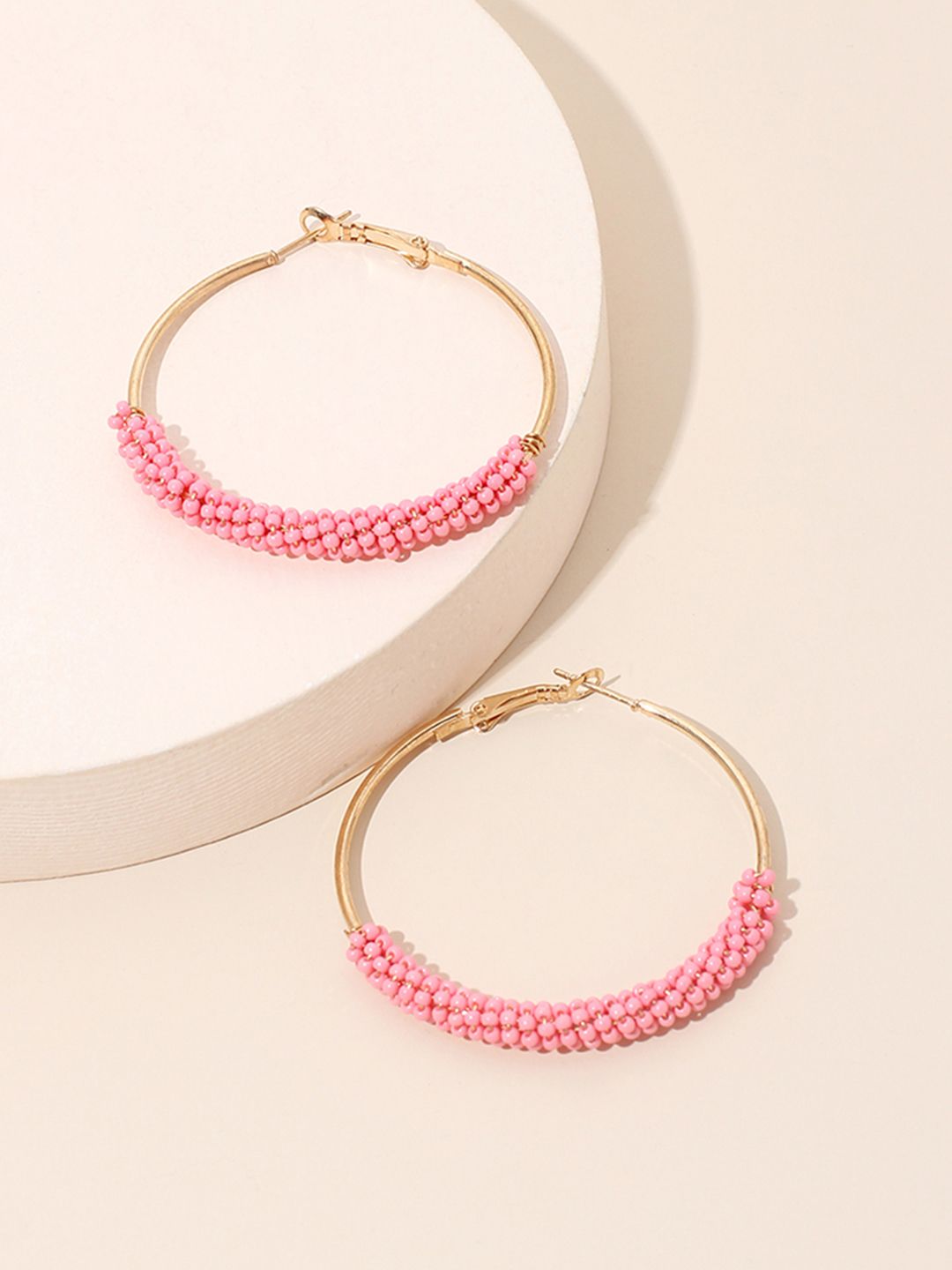URBANIC Pink & Gold-Toned Beaded Circular Hoop Earrings Price in India