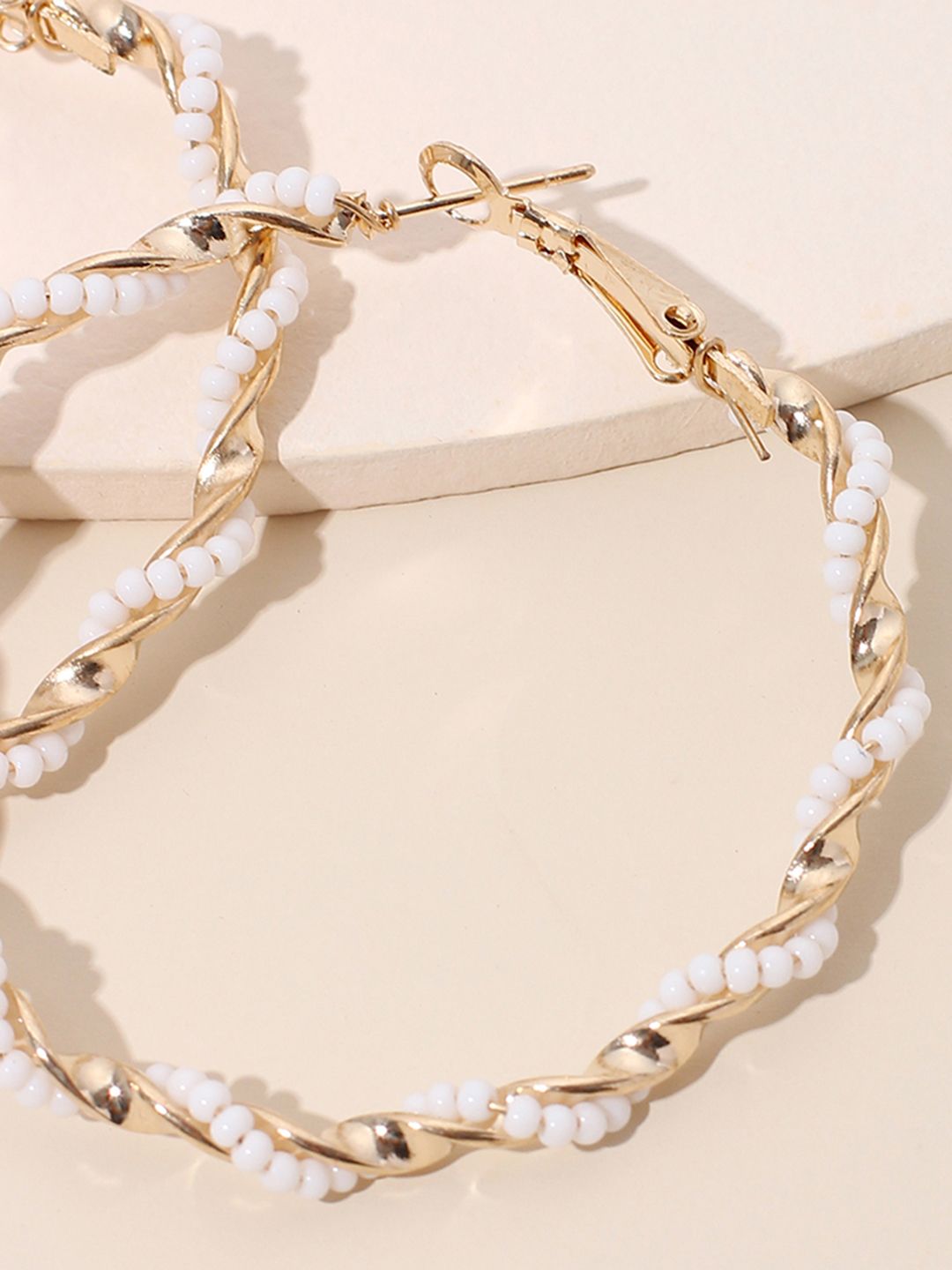 URBANIC White & Gold-Toned Beaded Circular Hoop Earrings Price in India