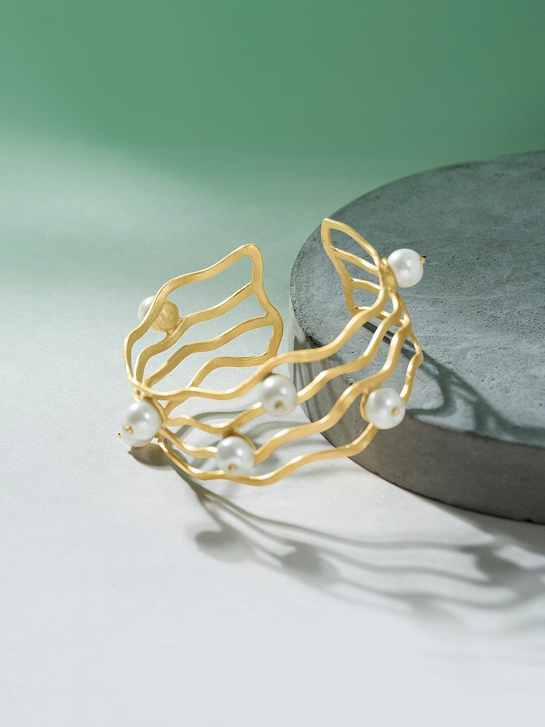 Mikoto by FableStreet Women Gold-Plated & White Brass Pearls Statement Swirl Cuff Bracelet Price in India