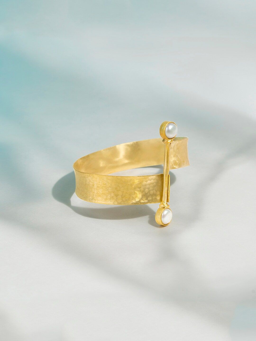 Mikoto by FableStreet Women Gold-Plated & White Brass Pearls Hammered Cuff Bracelet Price in India