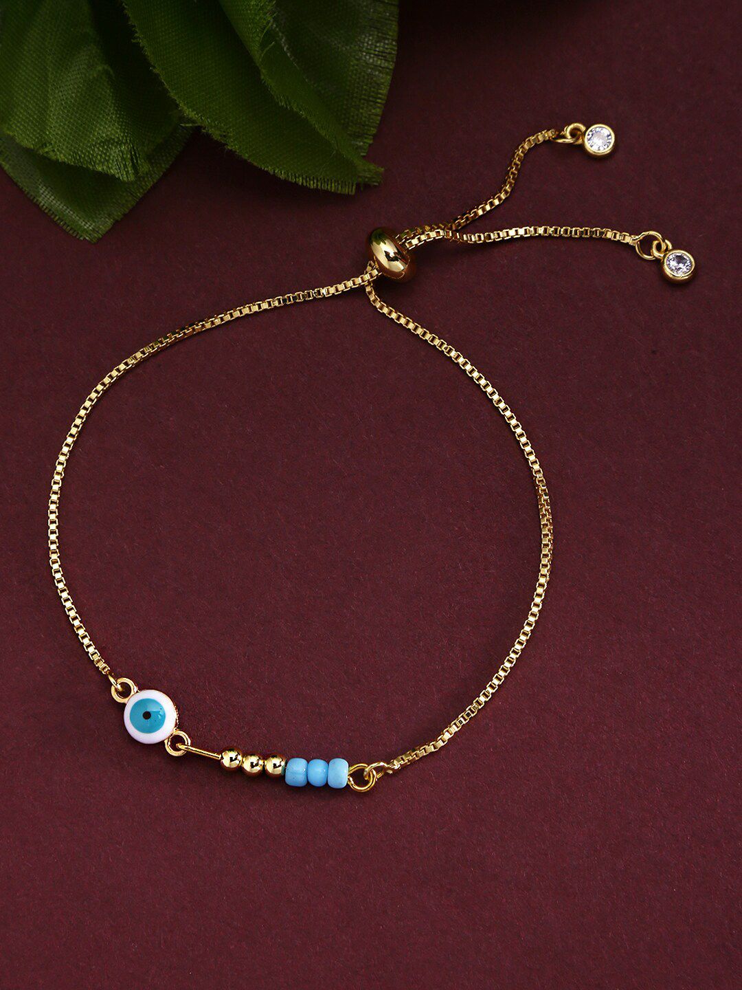 Yellow Chimes Women Gold-Toned & Turquoise Blue Beaded Evil Eye Bracelet Price in India