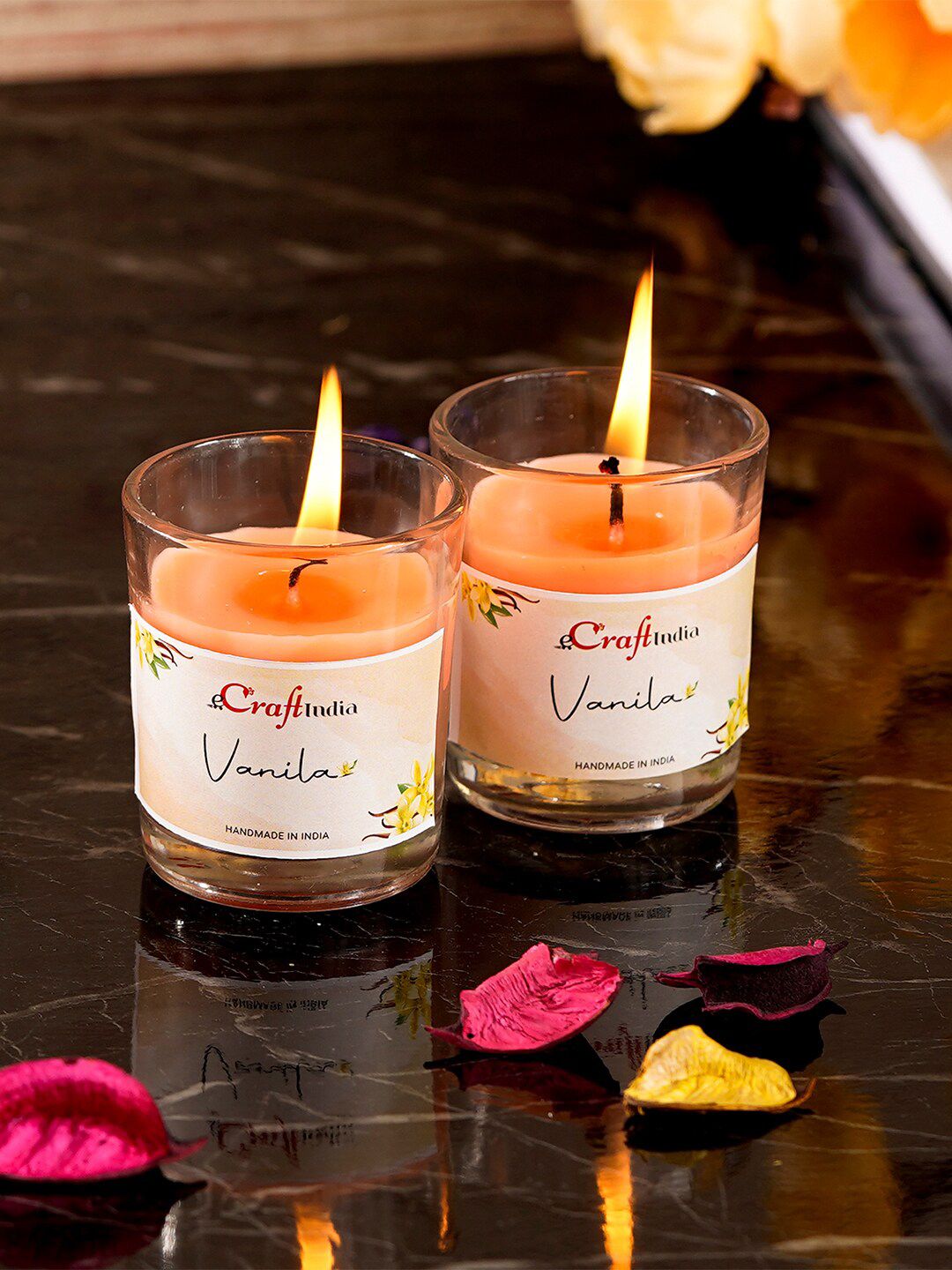 eCraftIndia Set Of 2 Orange Vanilla Scented Glass Candles Price in India