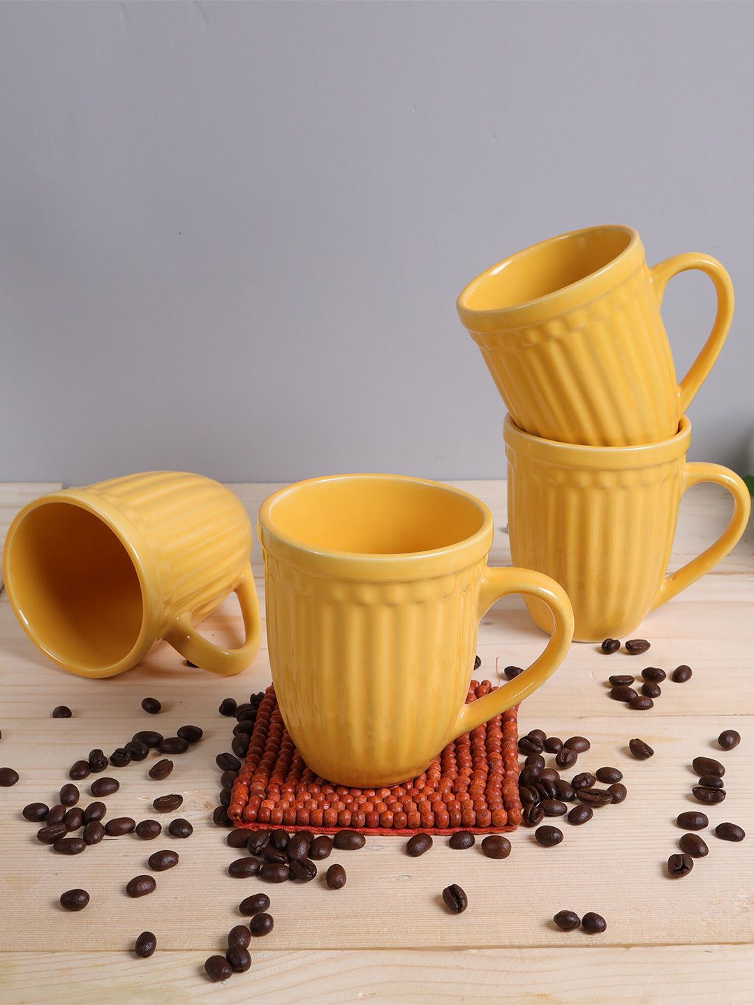 Homesake Yellow Set of 4 Solid Ceramic Glossy Mugs Price in India