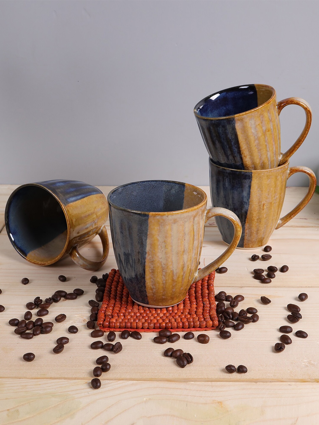 Homesake Set Of 4 Yellow & Navy Blue Textured Ceramic Glossy Mug Price in India