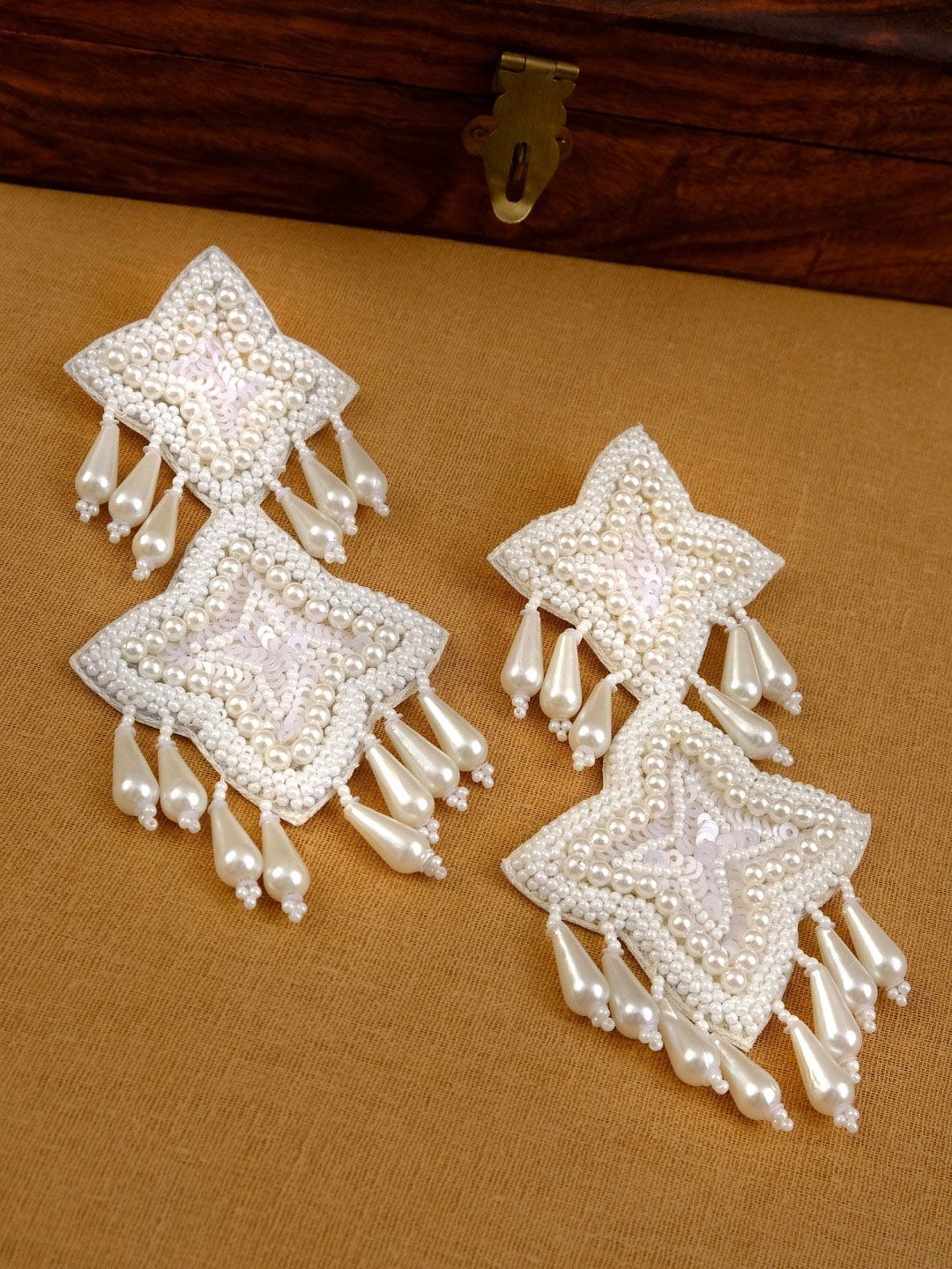 Crunchy Fashion White Contemporary Studs Earrings Price in India