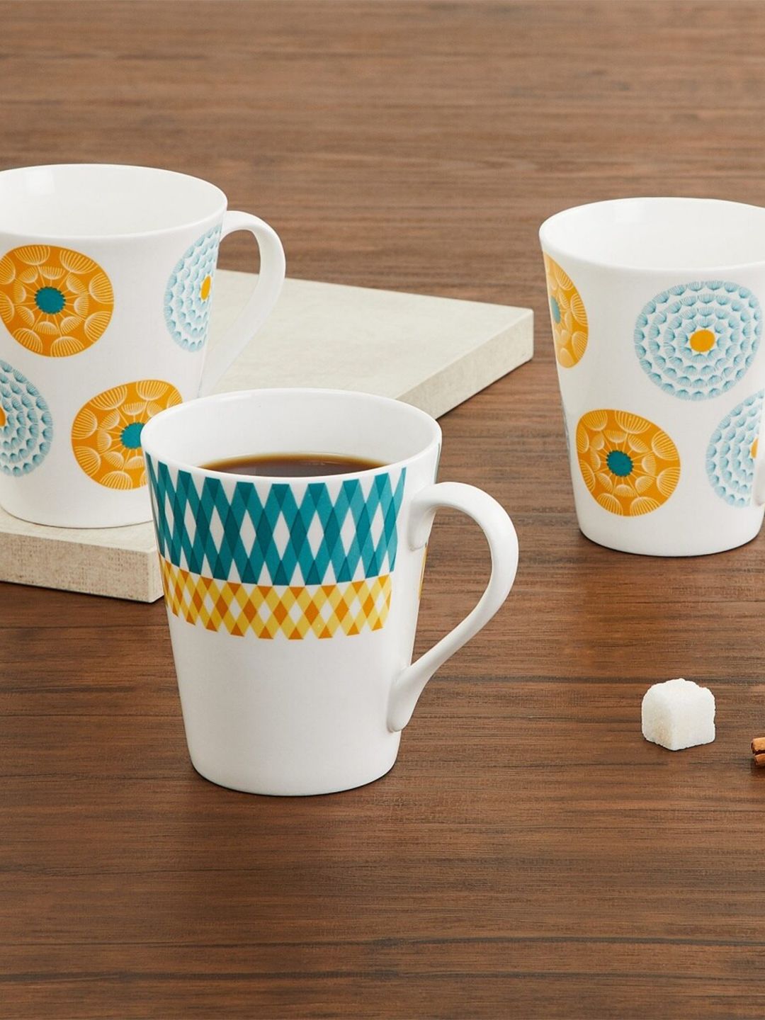 Home Centre Blue & Yellow Printed Bone China Glossy Mugs Set of Cups and Mugs Price in India