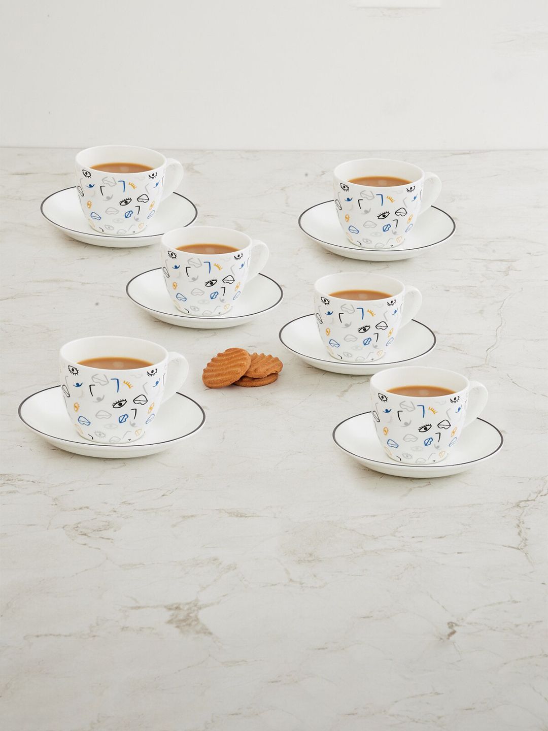 Home Centre Set Of 6 White & Blue Printed Bone China Glossy Cups and Saucers Price in India