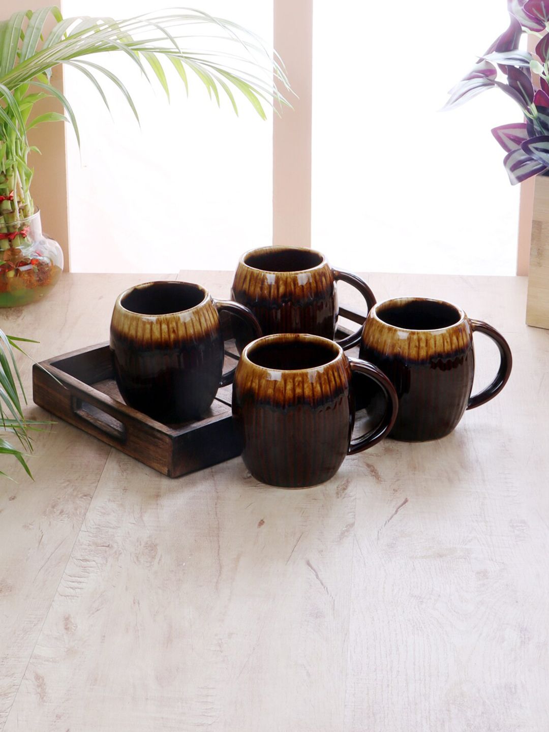 CDI Set Of 4 Brown & Gold-Toned Textured Ceramic Matte Cups with Wooden Tray Price in India