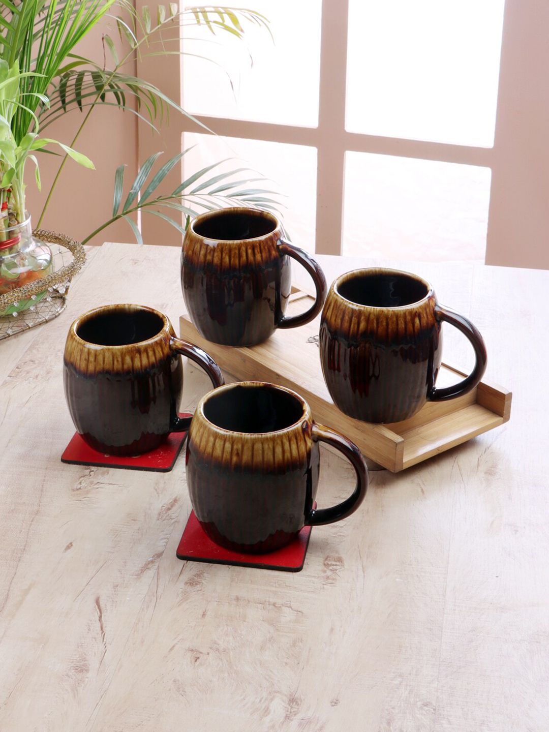 CDI Set Of 4 Brown & Beige Textured Ceramic Glossy Mugs Price in India