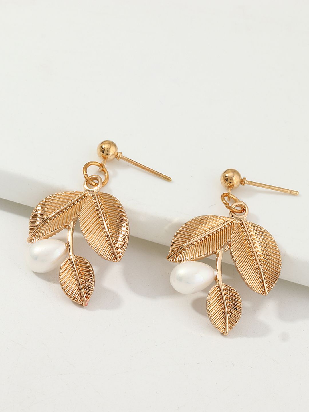 URBANIC Gold-Toned & Off-White Beaded Leaf Shaped Drop Earrings Price in India