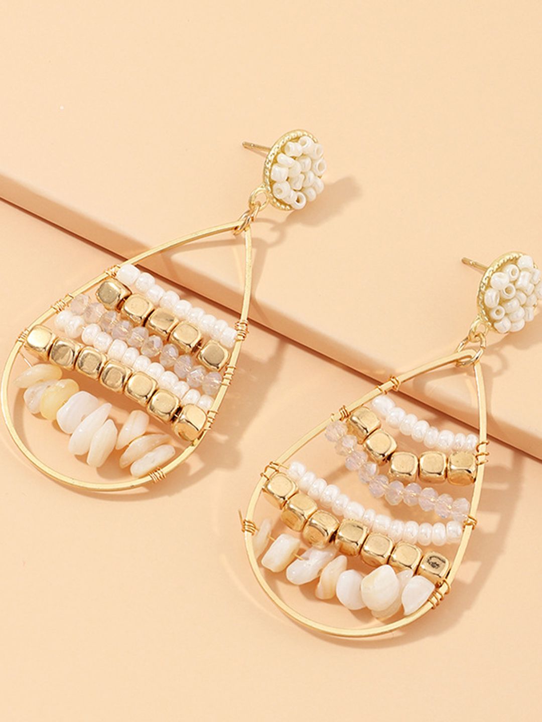 URBANIC Gold-Toned & Off-White Beaded Teardrop Shaped Drop Earrings Price in India