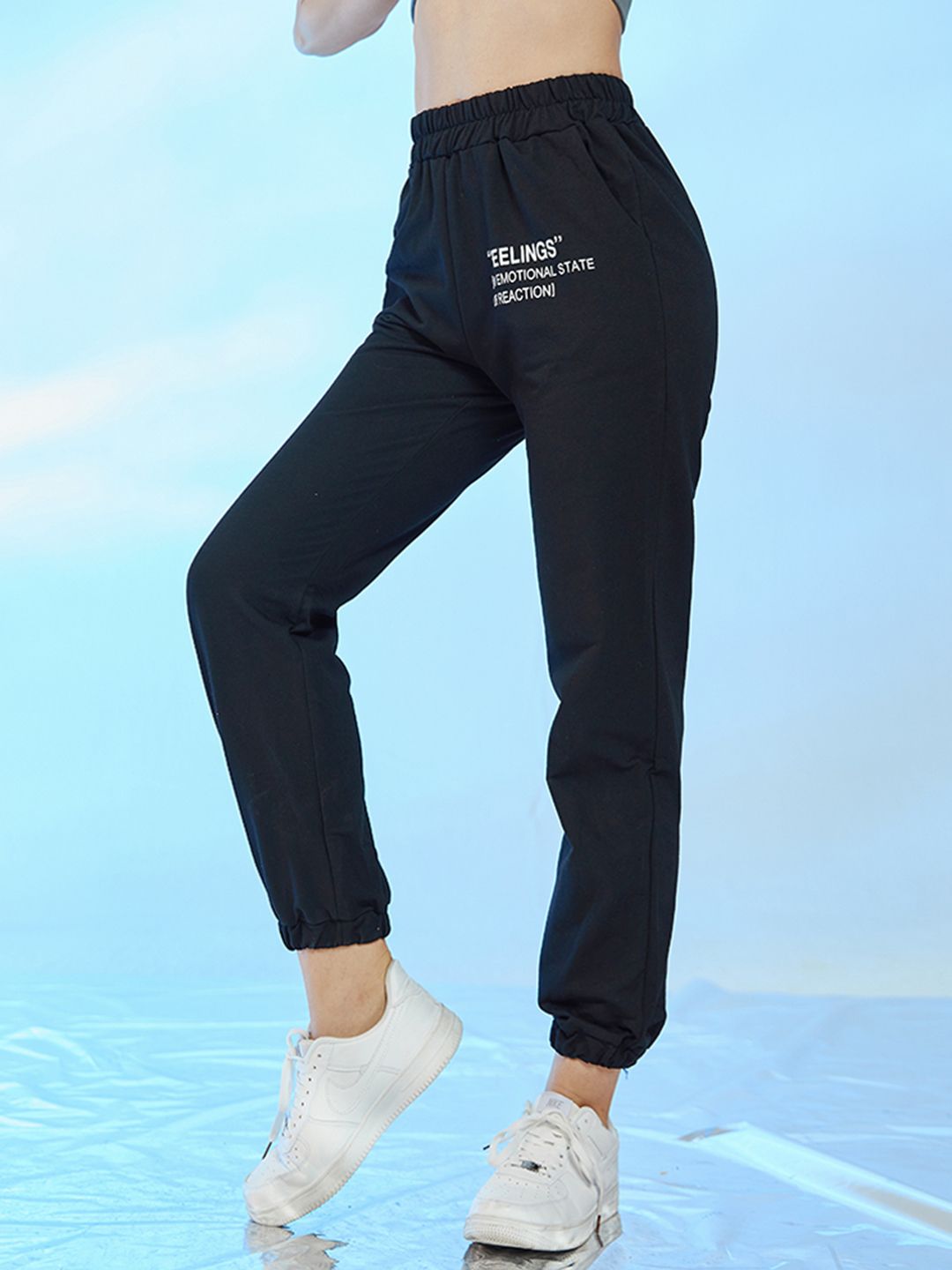 URBANIC Women Black Solid With Print Detail Cotton Relaxed Fit Joggers Price in India