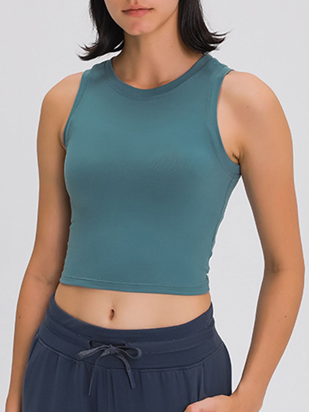 URBANIC Women Blue Solid Sleeveless T-shirt Price in India