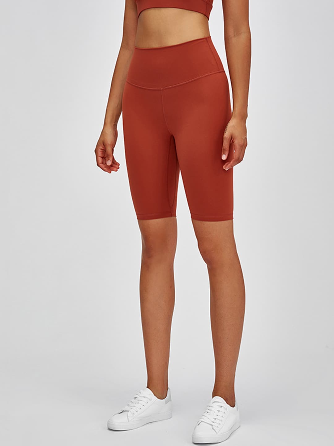 URBANIC Women Rust Orange Slim Fit High-Rise Gym Biker Shorts Price in India