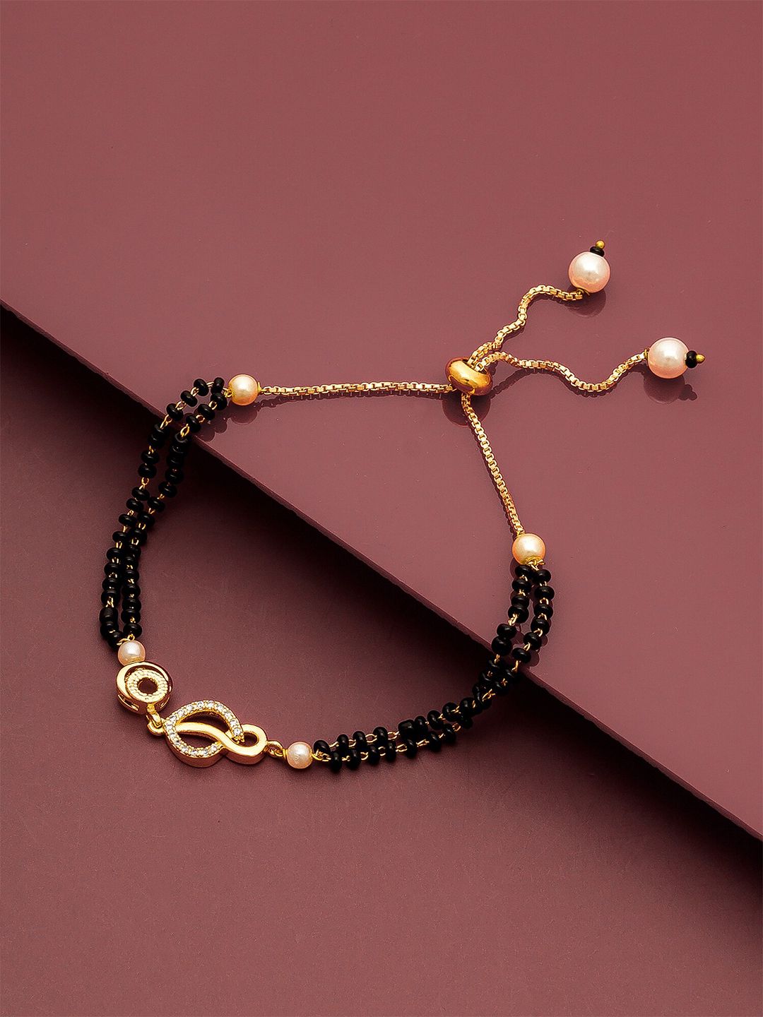 aadita Women Gold-Toned & Black Brass American Diamond Gold-Plated Mangalsutra Bracelet Price in India