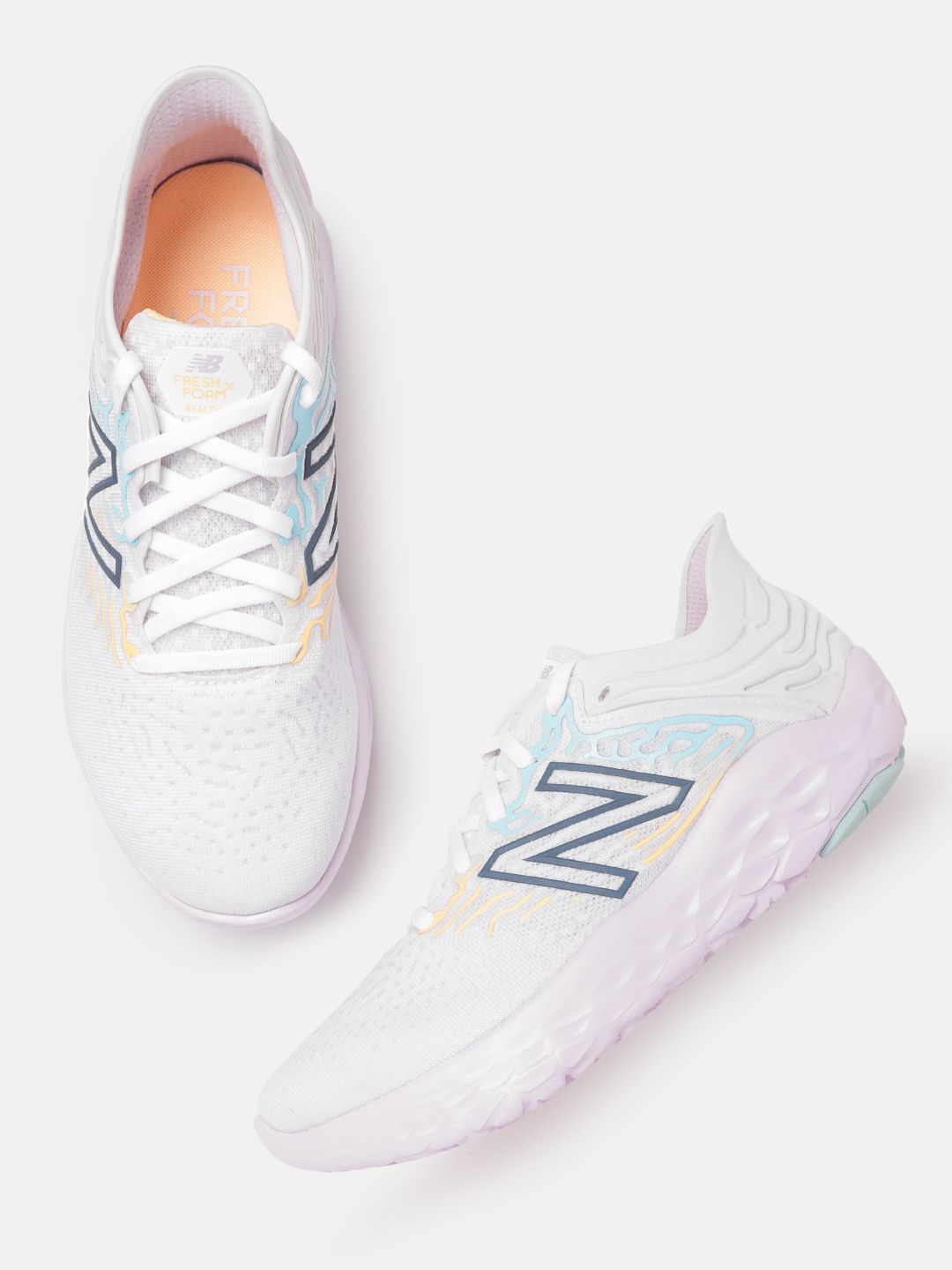 New Balance Women White & Blue Abstract Woven Design Running Shoes Price in India