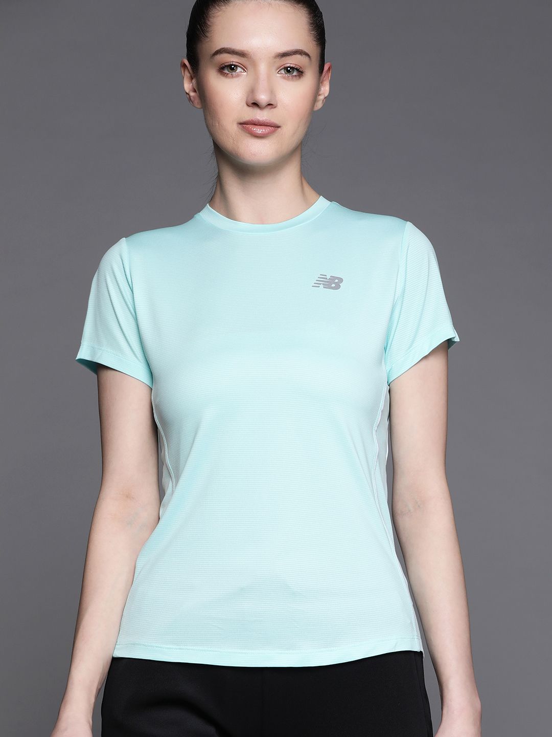 New Balance Women Blue Solid T-shirt Price in India