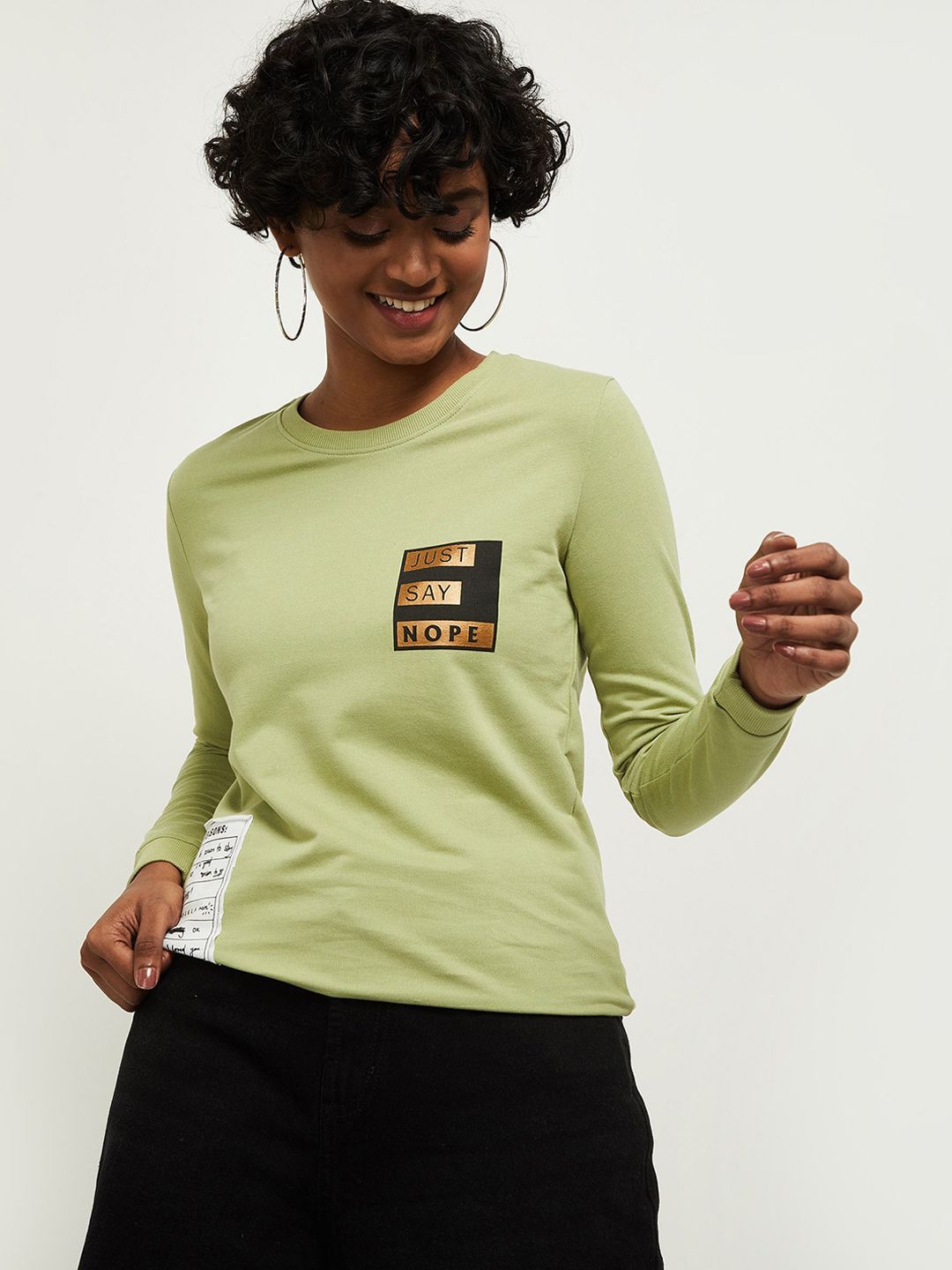 max Women Green Solid Round Neck Sweatshirt Price in India