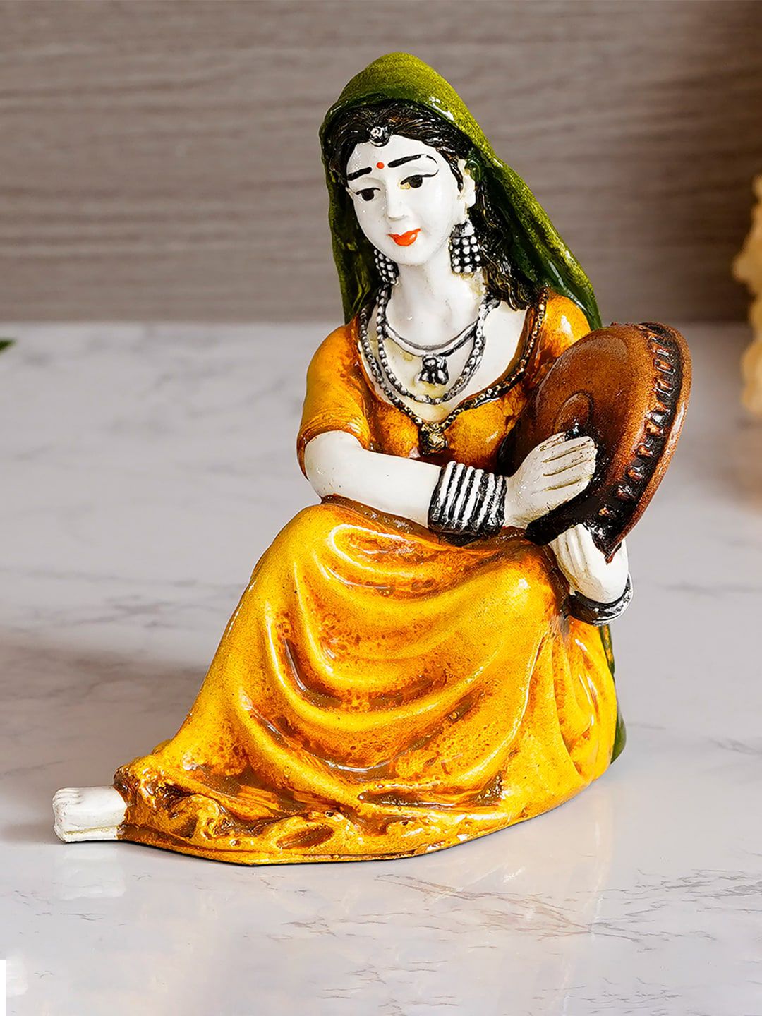 eCraftIndia Yellow & Green Polyresin Rajasthani Lady Playing Musical Instrument Showpiece Price in India