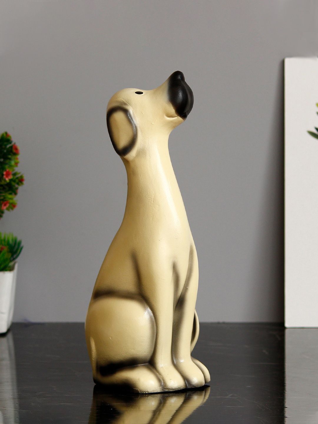 eCraftIndia Beige & Black Sitting White Dog Handcrafted Showpiece Price in India