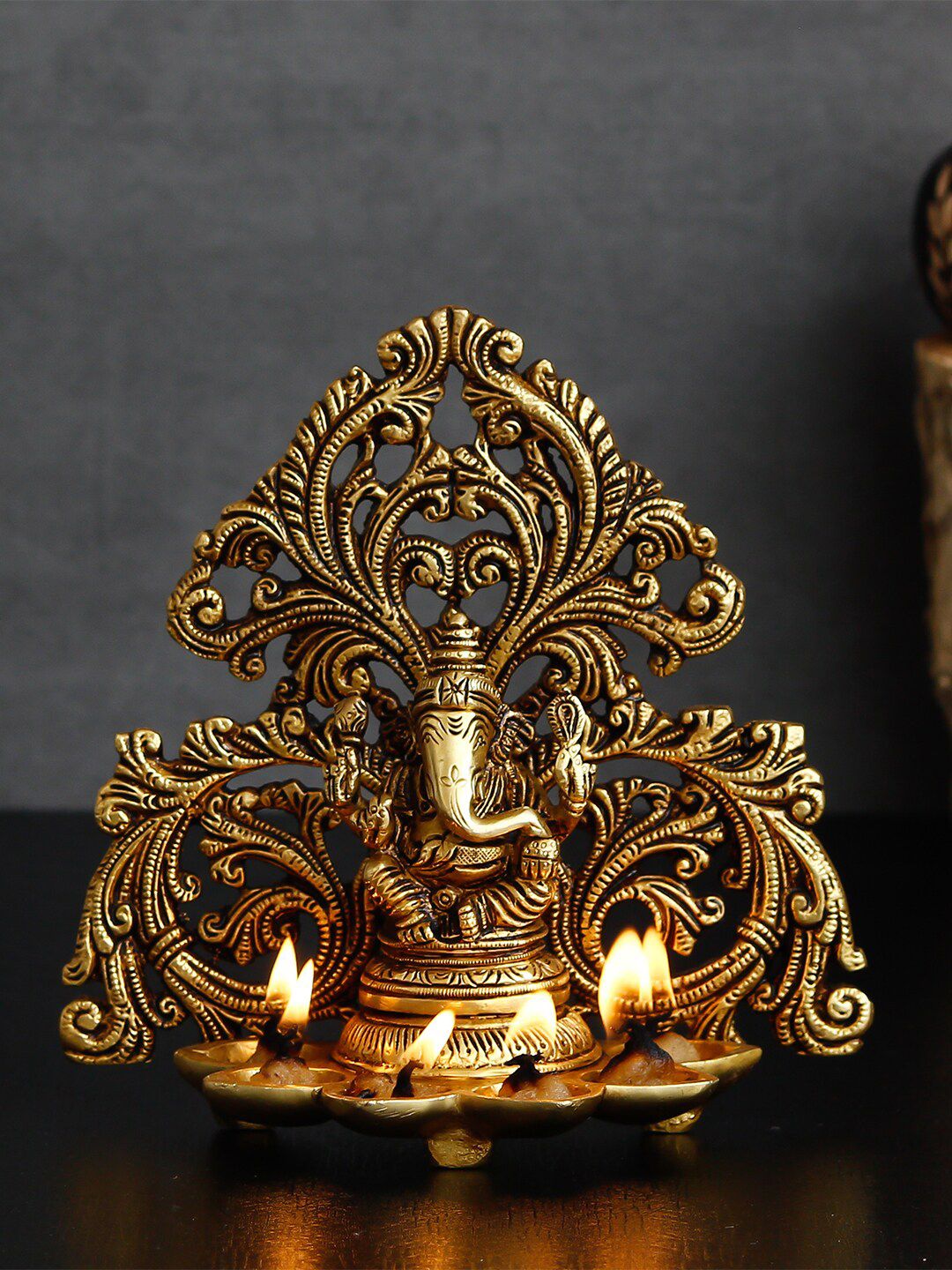 eCraftIndia Gold-Toned Handcrafted Lord Ganesha Brass Idol With 6 Diya Wicks Price in India
