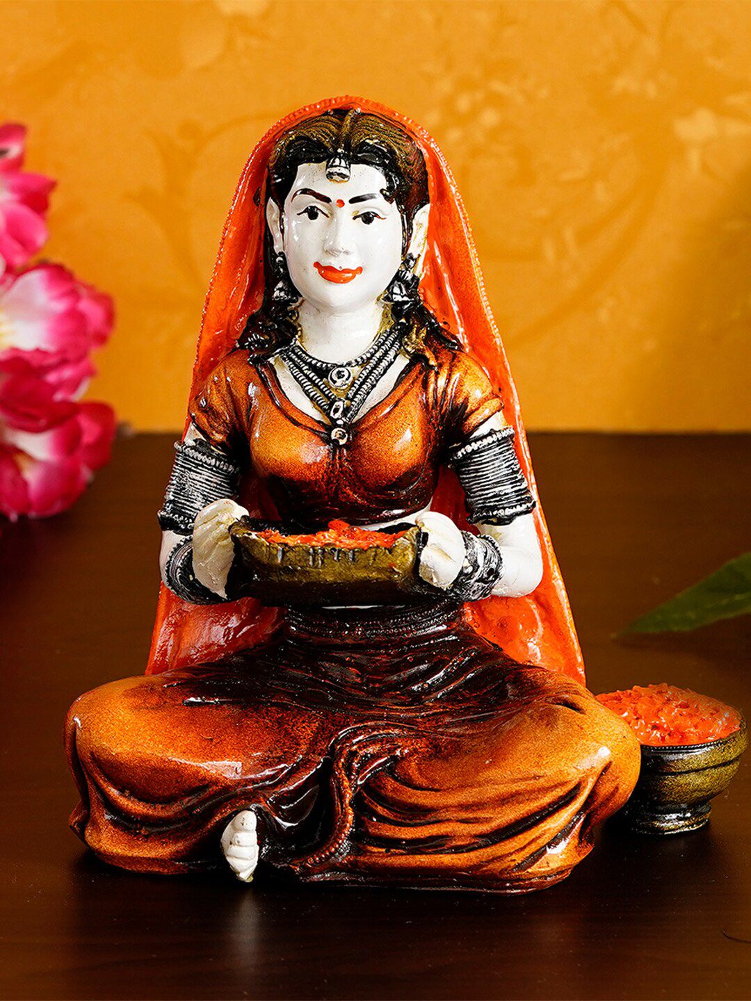 eCraftIndia Orange & Brown Handcrafted Rajasthani Lady Cleaning Spices Polyresin Showpiece Price in India