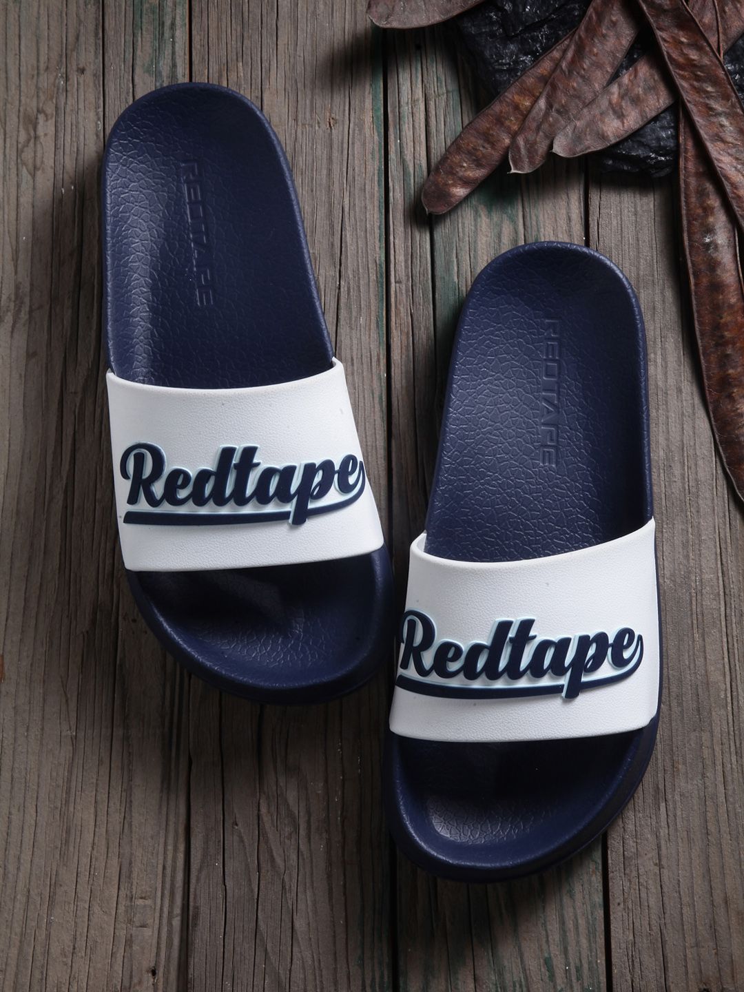 Red Tape Women White & Navy Blue Printed Rubber Sliders Price in India
