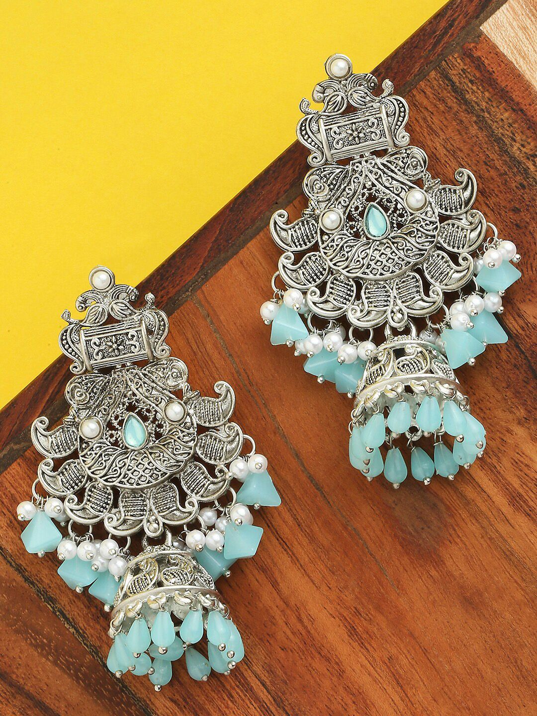 OOMPH Silver-Toned & Turquoise Blue Dome Shaped Jhumkas Earrings Price in India