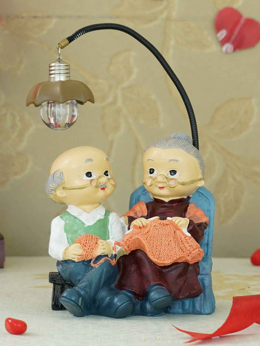 TIED RIBBONS Blue & Peach Coloured Old Age Couple Showpiece Price in India