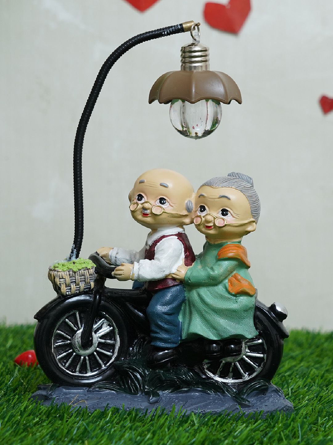 TIED RIBBONS Black & Beige Old Age Love Couple With Led Light Showpiece Price in India