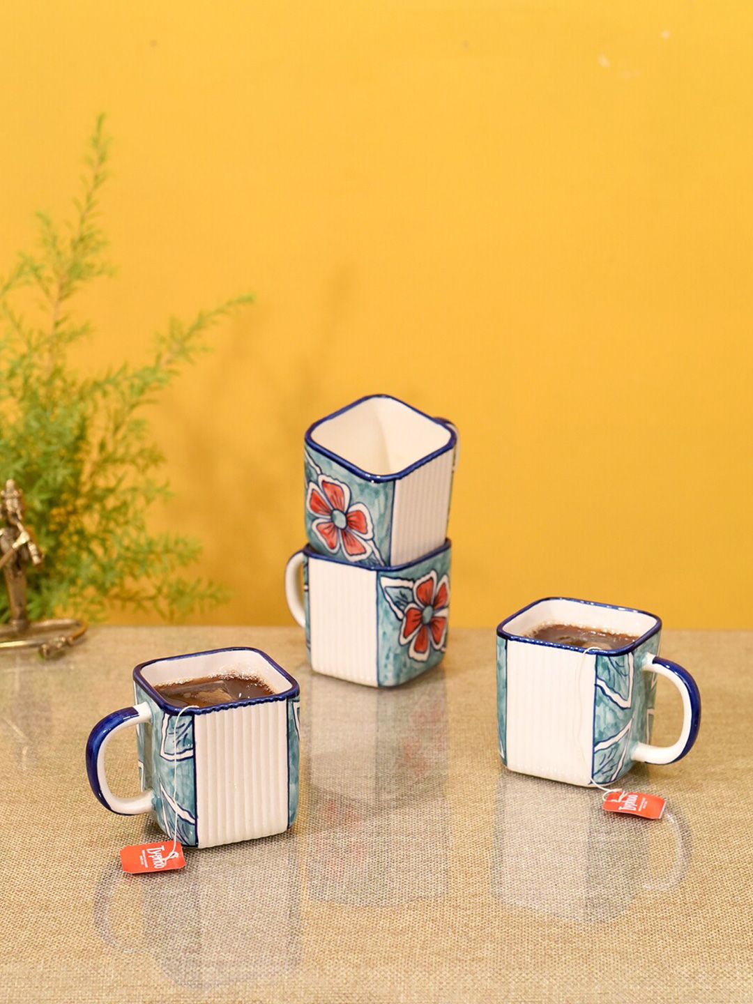 AAKRITI ART CREATIONS Set of 4 Blue & White Floral Printed Ceramic Glossy Mugs Price in India
