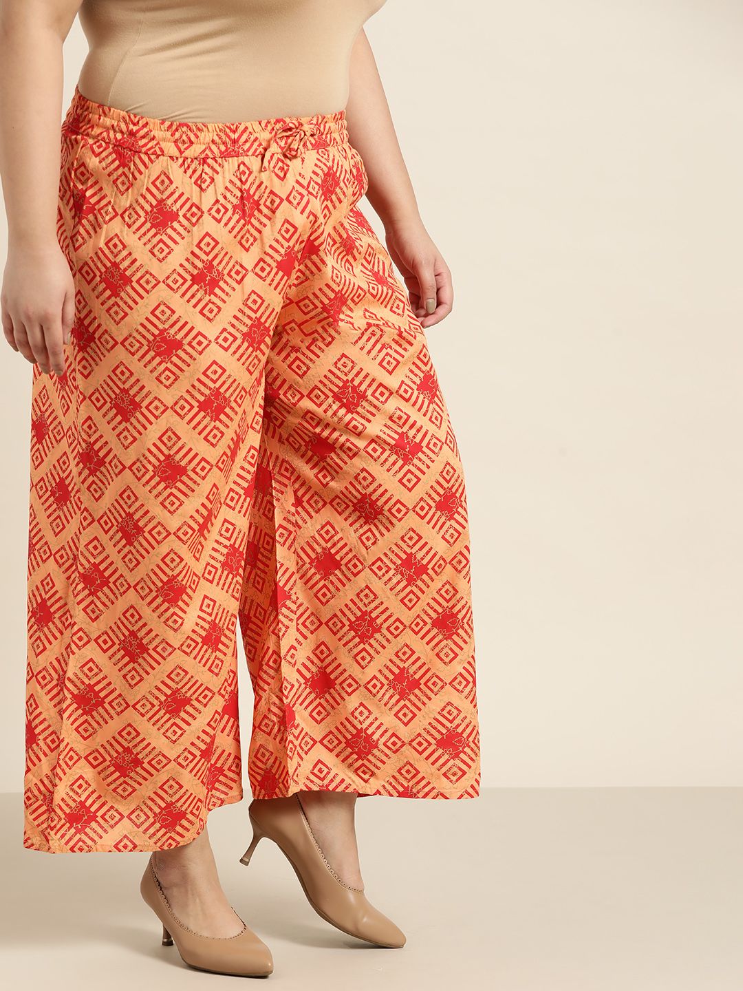 Sztori Women Plus Size Orange & Red Printed Geometric Printed Palazzos Price in India
