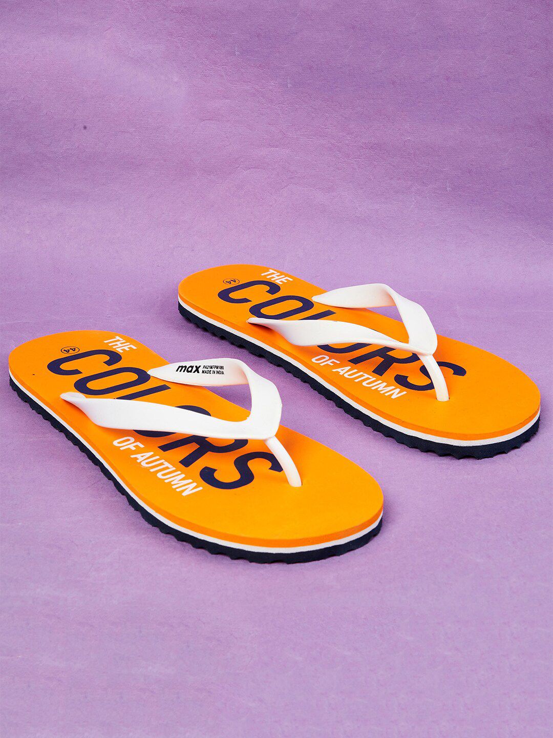 max Women Orange & White Printed Rubber Thong Flip-Flops Price in India